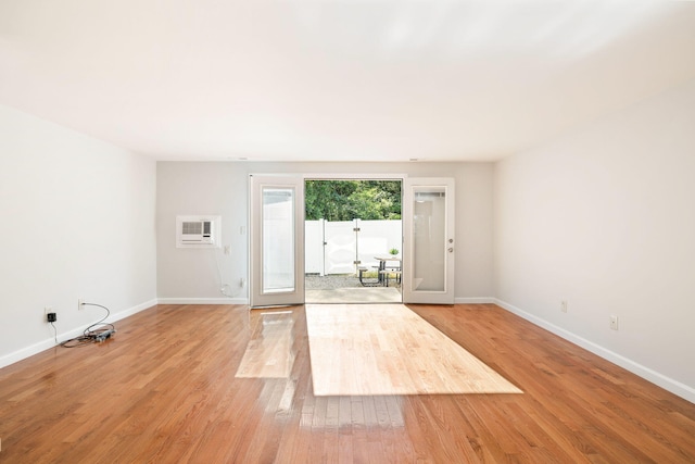 63 Pine Valley Dr Unit 63Aka 30A, Falmouth, MA 02540 - empty room with a wall unit AC and light wood-type flooring