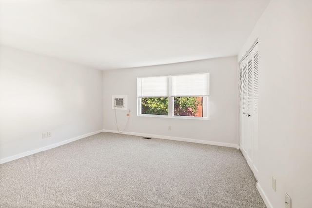 63 Pine Valley Dr Unit 63Aka 30A, Falmouth, MA 02540 - unfurnished bedroom with carpet flooring, an AC wall unit, and a closet