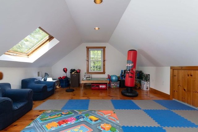 188 Church St, Duxbury, MA 02332 - playroom with lofted ceiling, wood finished floors, and a skylight