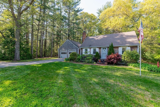 188 Church St, Duxbury, MA 02332 - view of front of home with asphalt driveway, a chimney, a front yard, and an attached garage