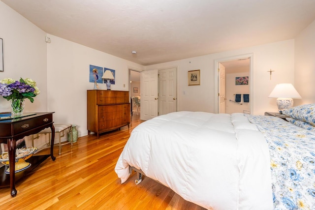 bedroom with hardwood / wood-style floors