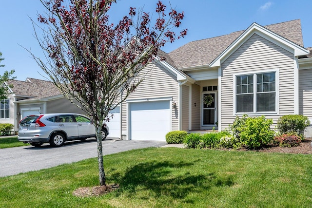 45 Grey Hawk Dr Unit 578, Mashpee, MA 02649 - ranch-style home featuring a front lawn, driveway, an attached garage, and roof with shingles