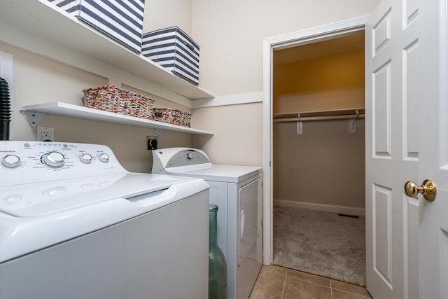 45 Grey Hawk Dr Unit 578, Mashpee, MA 02649 - laundry area featuring light tile patterned floors, baseboards, washing machine and clothes dryer, light carpet, and laundry area