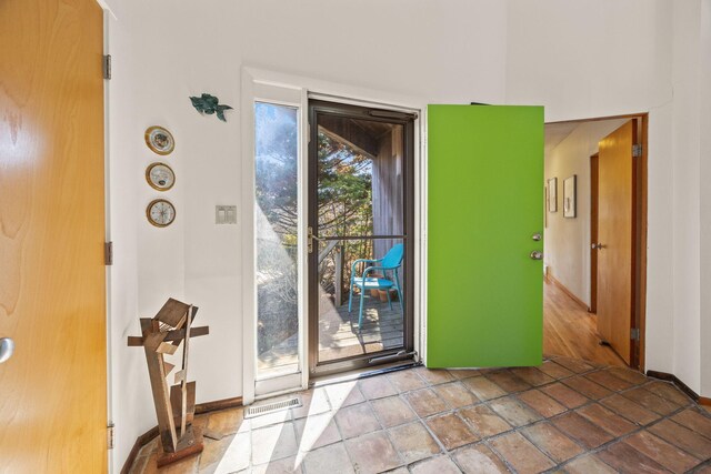 47 Fishermans Rd, Truro, MA 02666 - entryway featuring baseboards and stone tile floors