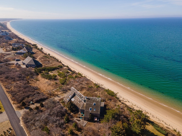 aerial view with a water view and a view of the beach