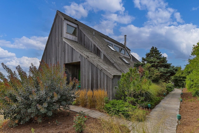 view of home's exterior featuring an outbuilding and a barn