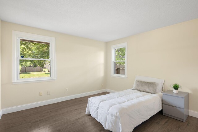 20 Terry Ln E, Wareham, MA 02571 - bedroom featuring multiple windows and dark wood-style floors