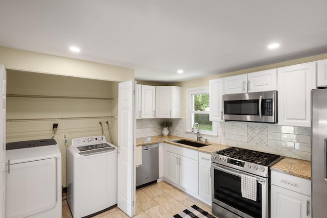 20 Terry Ln E, Wareham, MA 02571 - kitchen with appliances with stainless steel finishes, independent washer and dryer, white cabinets, and recessed lighting