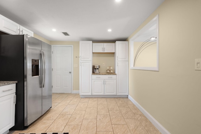 20 Terry Ln E, Wareham, MA 02571 - kitchen with stainless steel fridge, white cabinets, stone counters, and recessed lighting