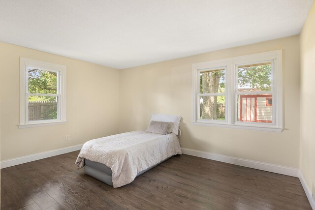 20 Terry Ln E, Wareham, MA 02571 - bedroom with multiple windows and dark wood-style floors