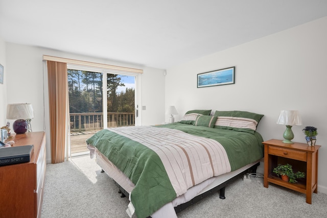 bedroom with carpet and access to outside