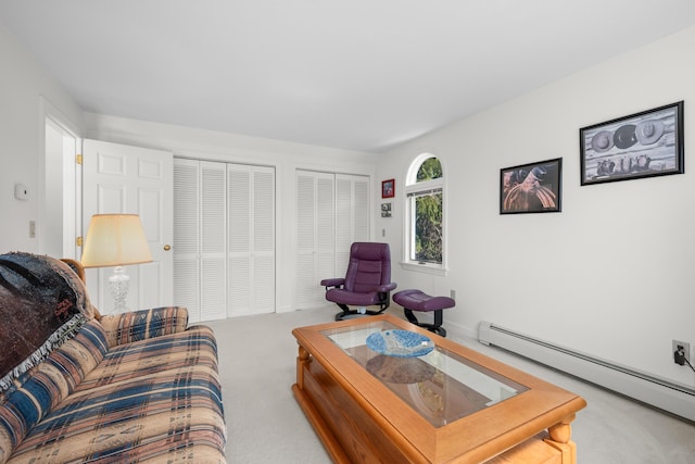 carpeted living area featuring baseboard heating