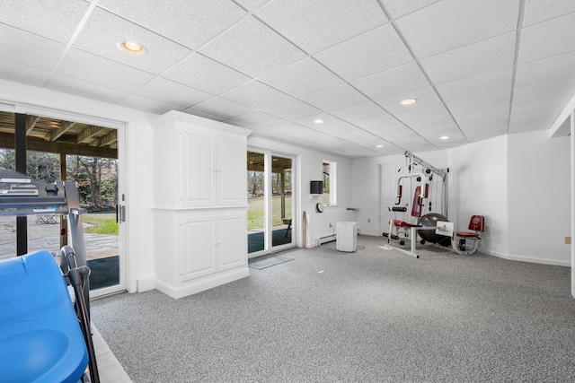 workout room featuring carpet floors, baseboards, a wealth of natural light, and recessed lighting