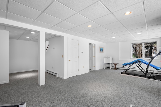 interior space featuring a baseboard radiator, carpet flooring, a drop ceiling, and recessed lighting