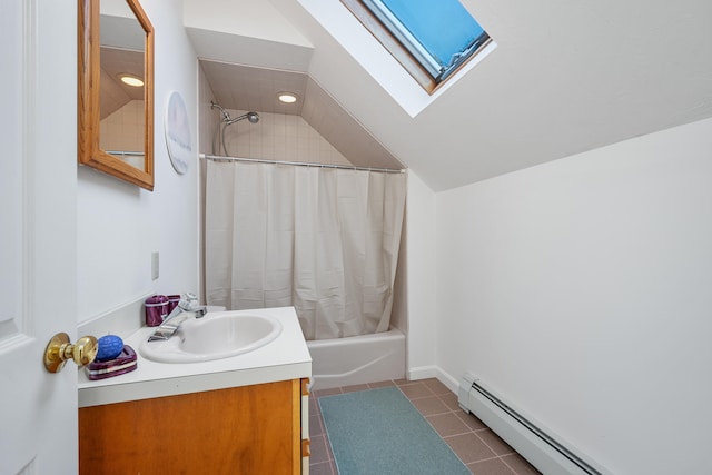 bathroom featuring tile patterned floors, lofted ceiling with skylight, shower / tub combo with curtain, vanity, and a baseboard radiator