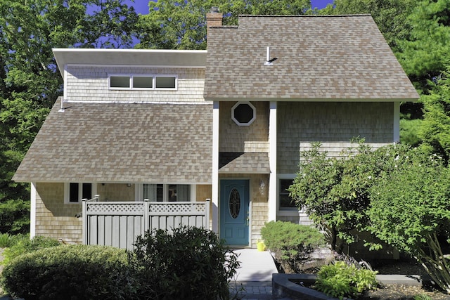 41 Halyard Ln, Mashpee, MA 02649 - view of front facade with roof with shingles and a chimney