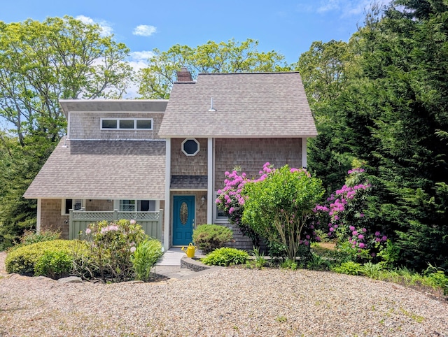 41 Halyard Ln, Mashpee, MA 02649 - view of front of house with a shingled roof, a chimney, and covered porch
