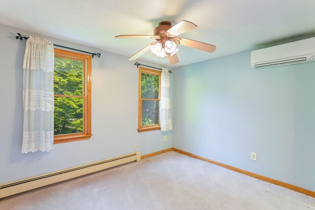 spare room featuring light carpet, baseboard heating, an AC wall unit, and ceiling fan