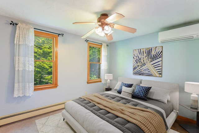 41 Halyard Ln, Mashpee, MA 02649 - bedroom featuring a baseboard radiator, an AC wall unit, and ceiling fan