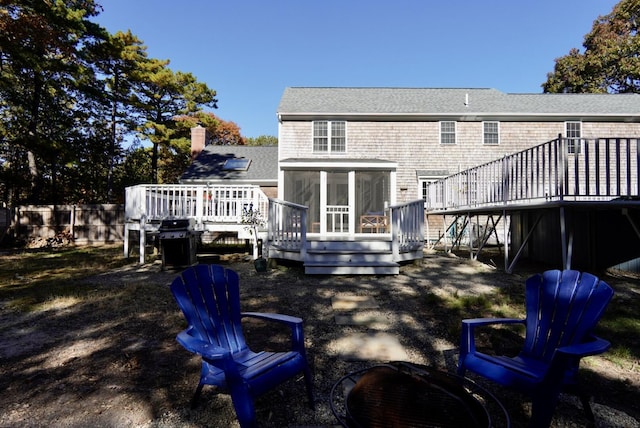 57 Camden Ln, Mashpee, MA 02649 - rear view of property with a sunroom, a deck, and a shingled roof