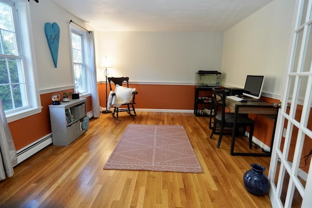 57 Camden Ln, Mashpee, MA 02649 - home office featuring a baseboard radiator, wood finished floors, and baseboards
