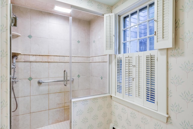 bathroom with a shower stall