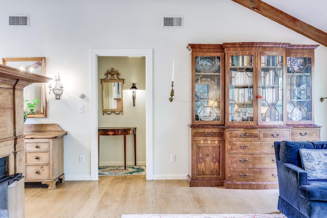 living area featuring light wood-style floors and baseboards