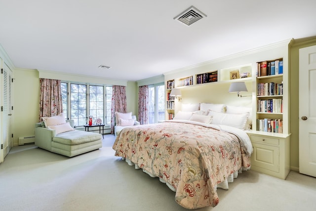 bedroom featuring baseboard heating and carpet