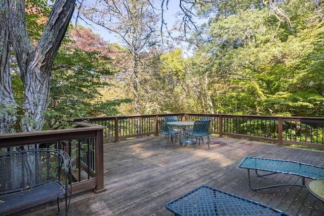 wooden deck with outdoor dining area