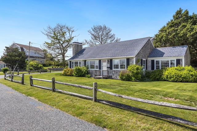 127 Short Beach Rd, Centerville, MA 02632 - view of front of house featuring a chimney and roof with shingles