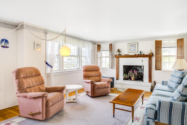 127 Short Beach Rd, Centerville, MA 02632 - living room featuring plenty of natural light, ornamental molding, a fireplace, and wood finished floors