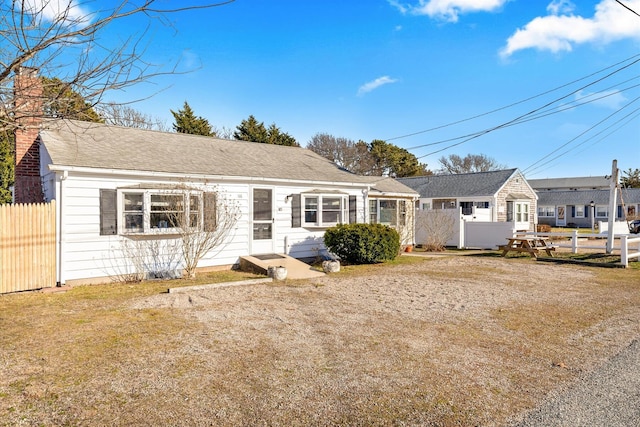 188 Captain Chase Rd, Dennis Port, MA 02639 - view of front facade with a chimney and fence