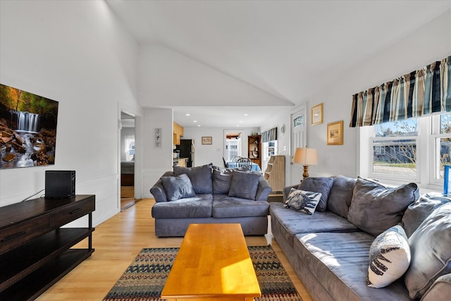 188 Captain Chase Rd, Dennis Port, MA 02639 - living area featuring light wood-style flooring, wainscoting, vaulted ceiling, and plenty of natural light