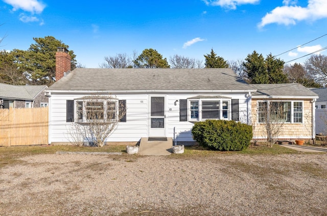 188 Captain Chase Rd, Dennis Port, MA 02639 - single story home featuring fence, a shingled roof, and a chimney