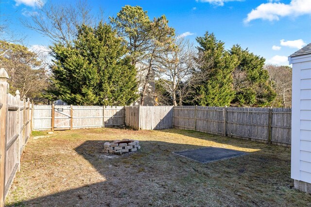188 Captain Chase Rd, Dennis Port, MA 02639 - view of yard with a fenced backyard and a fire pit
