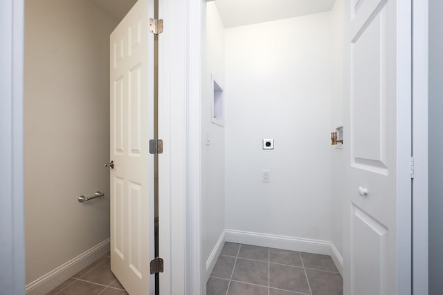 washroom with hookup for a washing machine, electric dryer hookup, laundry area, baseboards, and tile patterned floors