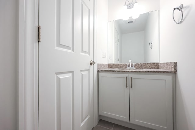 bathroom with tile patterned flooring, visible vents, and vanity