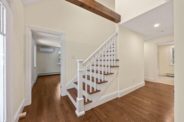 507 S Orleans Rd, Orleans, MA 02653 - stairs featuring an AC wall unit, a baseboard heating unit, wood finished floors, baseboards, and recessed lighting
