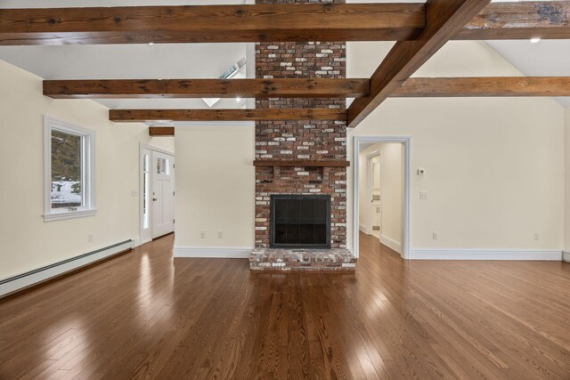 507 S Orleans Rd, Orleans, MA 02653 - unfurnished living room featuring wood finished floors, baseboards, a fireplace, and baseboard heating
