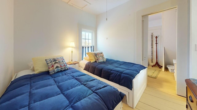 bedroom featuring light hardwood / wood-style flooring and a closet