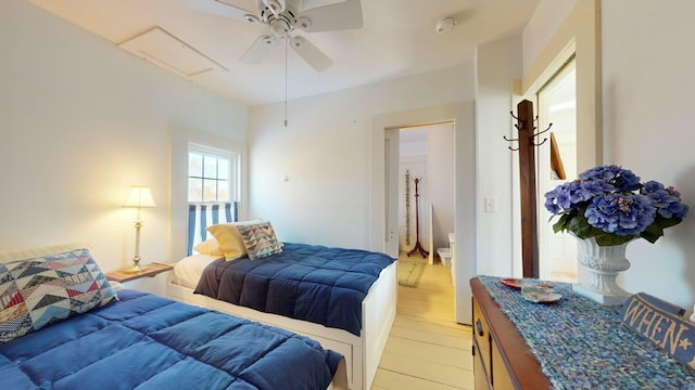 bedroom with ceiling fan and light wood-type flooring