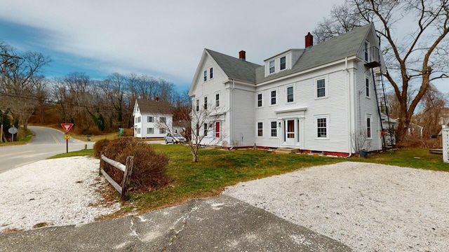 view of home's exterior featuring a yard