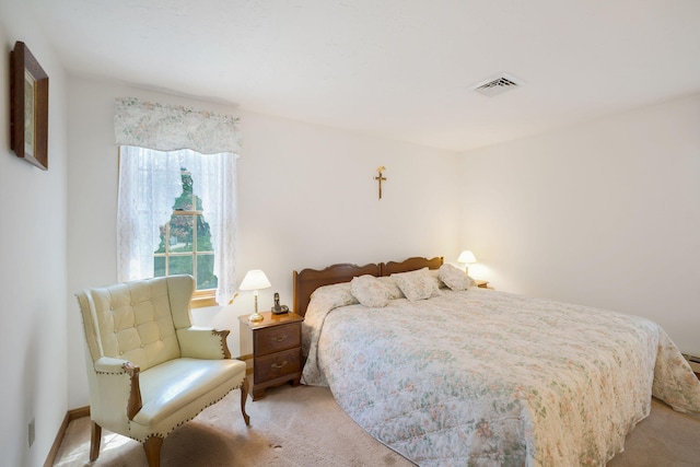 bedroom featuring light colored carpet