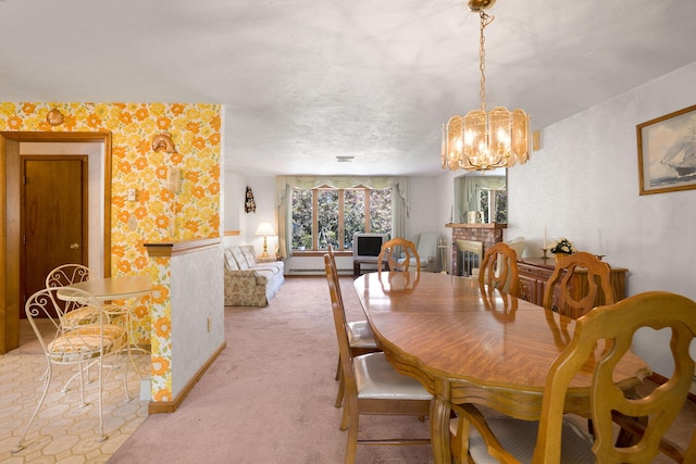 dining room with light carpet, wallpapered walls, and a chandelier