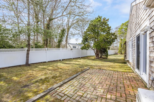view of yard with a patio and a fenced backyard