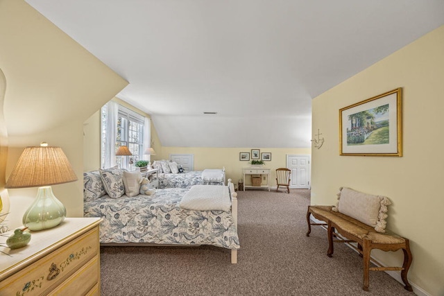 bedroom with baseboards, lofted ceiling, and carpet