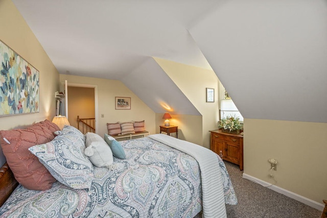 bedroom featuring carpet floors, baseboards, and lofted ceiling