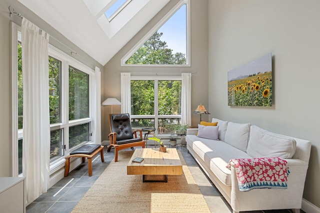 130 Daniels Dr, Wellfleet, MA 02667 - living room with high vaulted ceiling, a skylight, and dark tile patterned flooring