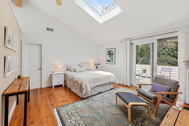 130 Daniels Dr, Wellfleet, MA 02667 - bedroom featuring access to outside, a skylight, light wood-style floors, high vaulted ceiling, and ceiling fan
