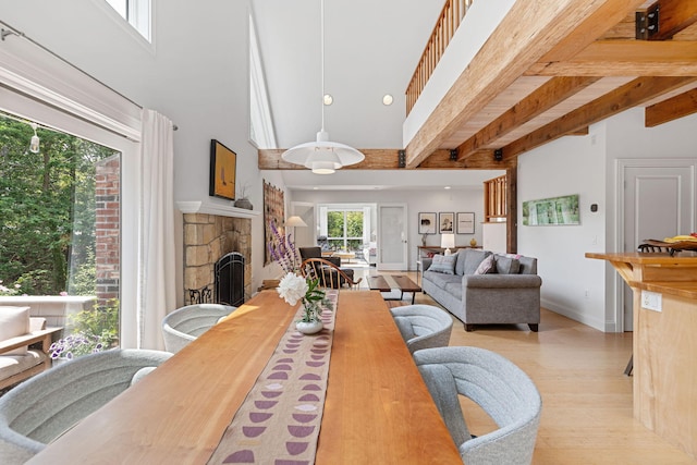 130 Daniels Dr, Wellfleet, MA 02667 - dining room with a stone fireplace, wood finished floors, and beam ceiling